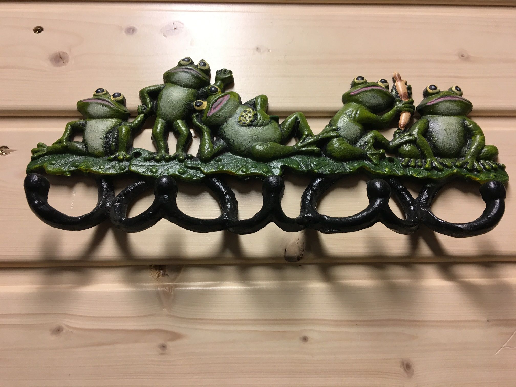 Coat rack with frogs
